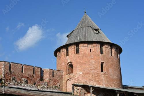 Veliky Novgorod. Kremlin. Part of the old tower and the fortress wall of brick and stones. Metropolitan tower of the Vladychny the yard.Novgorod Detinets UNESCO World Heritage Site. photo