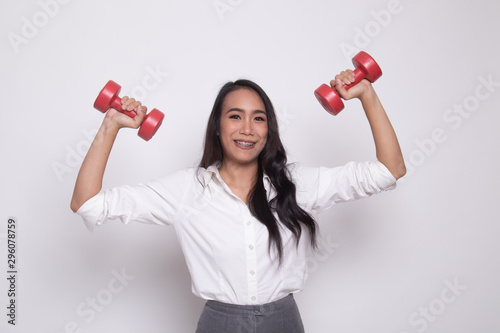 Healthy Asian woman with dumbbells.