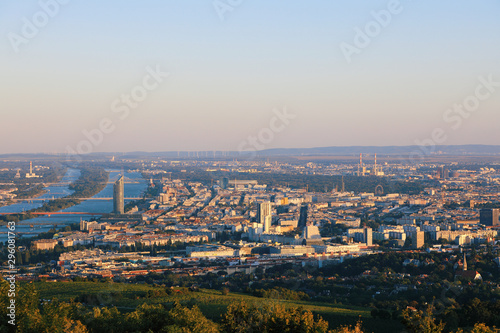 Vienna, Austria - 21 September 2019: Beautiful view of the evening skyline of Vienna and Danube River with green trees of Doebling district, Austria. Travel photo of the landmark
