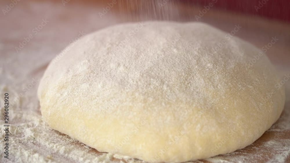 An experienced chef in a professional kitchen prepares the dough with flour to make the bio Italian pasta. the concept of nature, Italy, food, diet and bio. An experienced chef in a professional kitchen prepares the dough with flour to make the bio Italian pasta. the concept of nature, Italy, food, diet and bio.