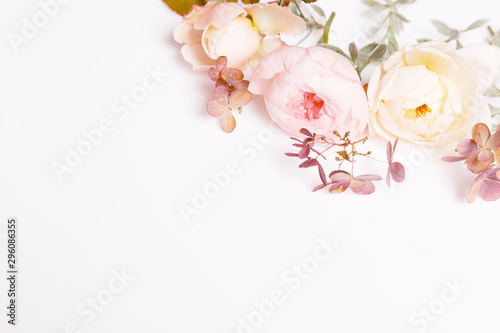 Festive flower composition on the white background. Overhead view © Olga Ionina