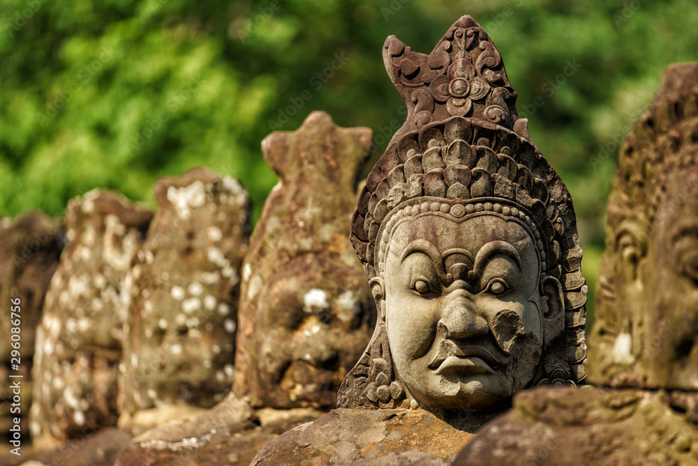 Row of sculptures in the South Gate of Angkor Thom