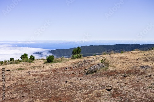Panoramic view of a desertic place with shrubs above clouds (Madeira, Portugal, Europe)