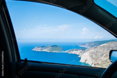 Picturesque Assos village in Kefalonia ionian island in Greece. View from a car's window