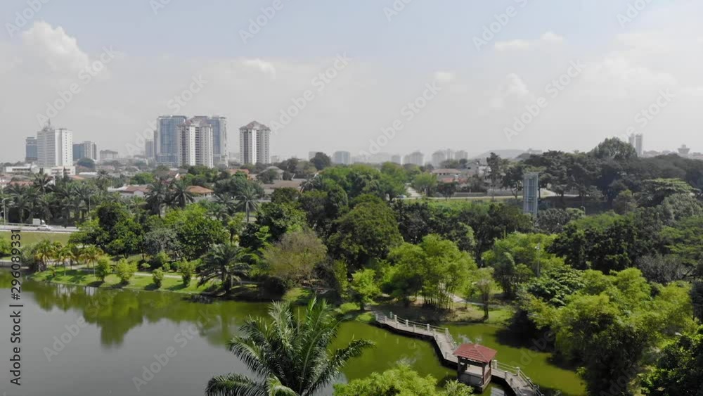 Top Aerial View of the Lake with a Garden Full of Trees in Malaysia City - Dolly Left To Right Top Aerial View of the Lake with a Garden Full of Trees in Malaysia City - Dolly Left To Right