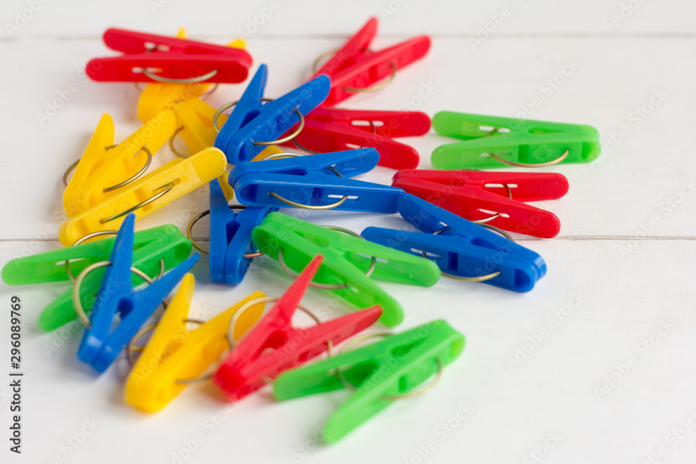 bright colored clothespins lie on the table bright colored clothespins lie on the table