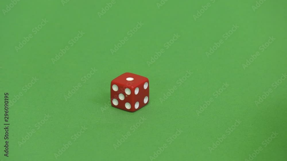 Green screen shot of a red dice rolling 1 Green screen shot of a red dice rolling 1