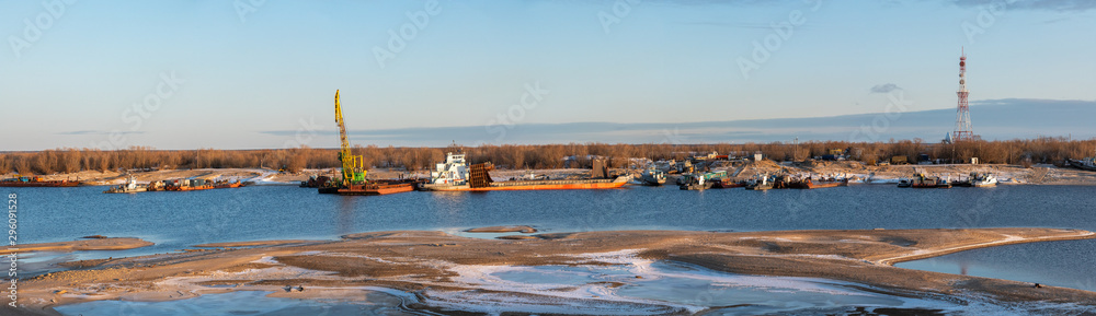 Yakutsk, Yakutia, Sakha Republic/Russia-October 13 2019: Preparation of river vessels for winter.  Recovery vessels on coastal winter parking