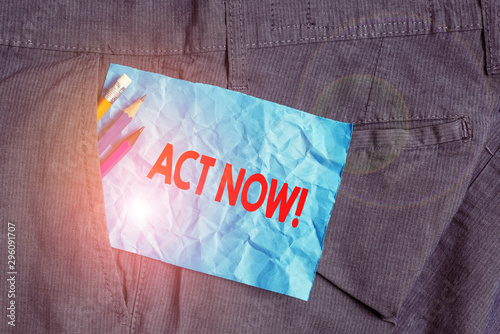 Text sign showing Act Now. Business photo showcasing fulfil the function or serve the purpose of Take action Do something Writing equipment and blue note paper inside pocket of man work trousers