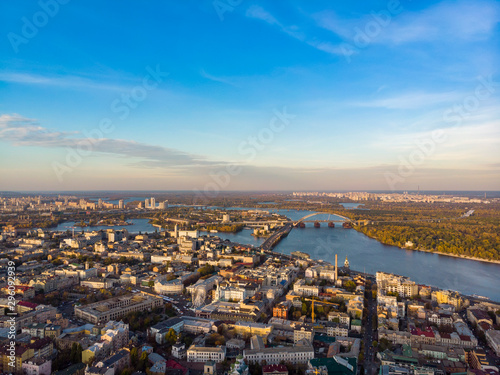 Aerial top view of Kyiv cityscape, Dnieper river and Podol historical district skyline from above, Kontraktova square with ferris wheel, city of Kiev, Ukraine