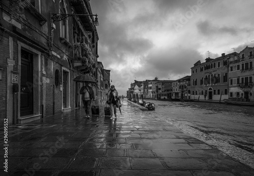 Bad weather in Venice. Bridges and architecture of the old city. Italy. Black and white.