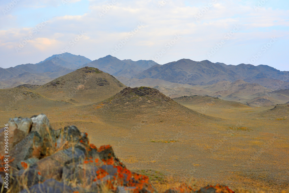 Mountains with yellow grass on autumn in Kegen region of Kazakhstan