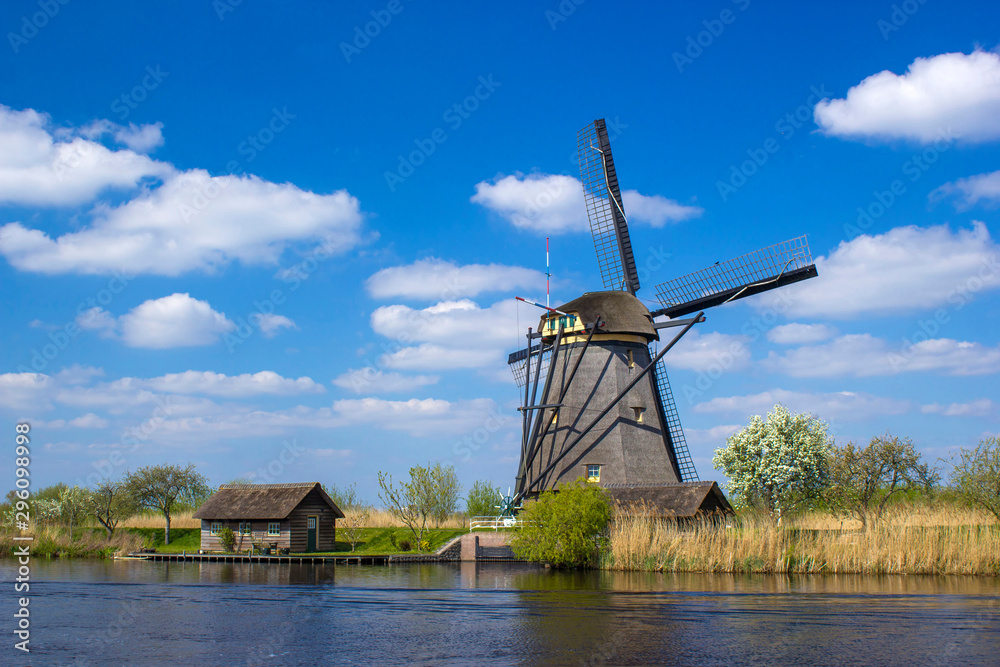 rural lanscape with windmills at famous tourist site Kinderdijk in Netherlands