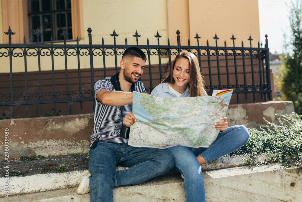 couple tourist in sightseeing in city using paper map couple tourist in sightseeing in city using paper map