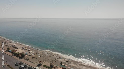 Alanya Turkey Panoramic aerial view of beaches from Mahmutlar to Alanya Castle on the Turkish Mediterranean Coast. Tourists and enjoy their vacation. The D400 runs alongside the beaches. photo