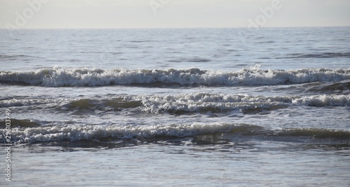 waves crashing. waves crashing ashore. waves crashing on the ocean. waves on ocean. waves on beach. 