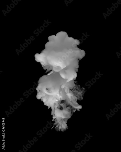 White paint in the water. The effect of smoke from white paint in on a black background.