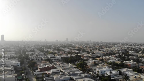 Top Aerial View of the City of Karachi with skyscrapers view and beautiful skies - Dolly Front  photo