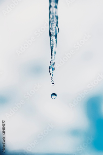 drop of water and ice. drop water and sky as background. colorful background. clouds as background. water splash isolated on white and blue background. water splash isolated on white clouds. liquid