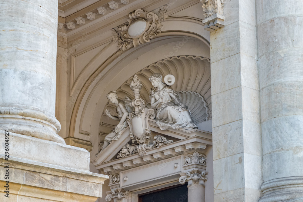 National Museum of Romanian History building in Bucharest, Romania. National Museum of Romanian History on a sunny summer day with a blue sky. Statue detail