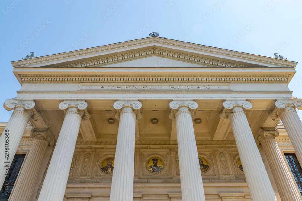 Romanian Athenaeum, a concert hall in the center of Bucharest, Romania and a landmark of the Romanian capital city. Romanian Athenaeum a sunny summer day with blue sky in Bucharest, Romania