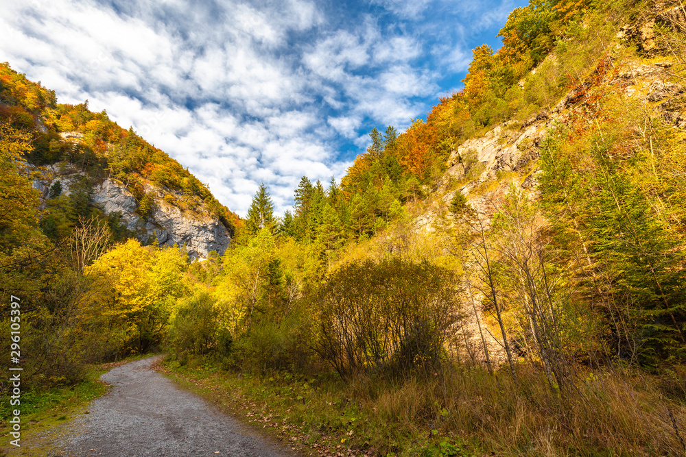 Mountain landscape in autumn sunny day. Hiking trail through Kvacianska valley, Slovakia, Europe. Mountain landscape in autumn sunny day. Hiking trail through Kvacianska valley, Slovakia, Europe.