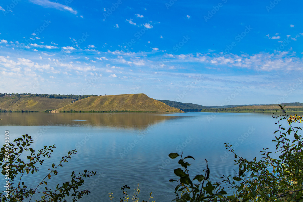 nature reservation hill land scenery landscape photography of lake smooth water branches foliage in summer clear weather time 