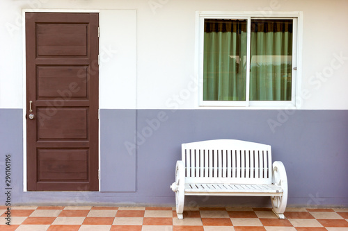 white bench with window and door