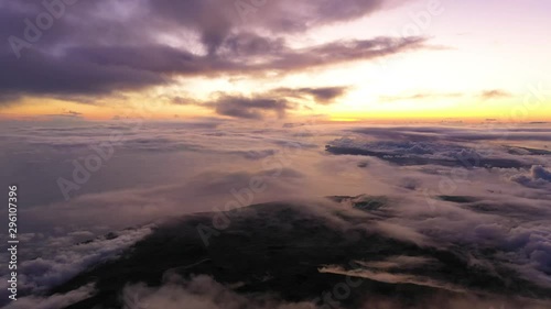 Panning of amazing view, above clouds, from Pico Mountain top on Azores island at sunset. photo