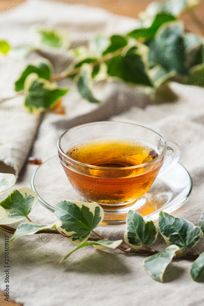 Cup of hot green tea on a wooden table Cup of hot green tea on a wooden table