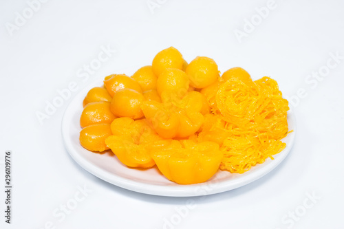 egg yoke fudge balls cooked in syrup on background