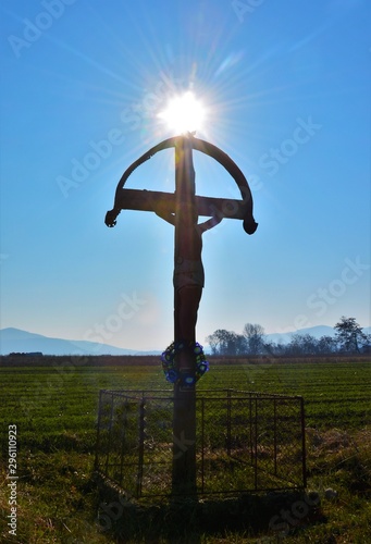 the sun above a cross