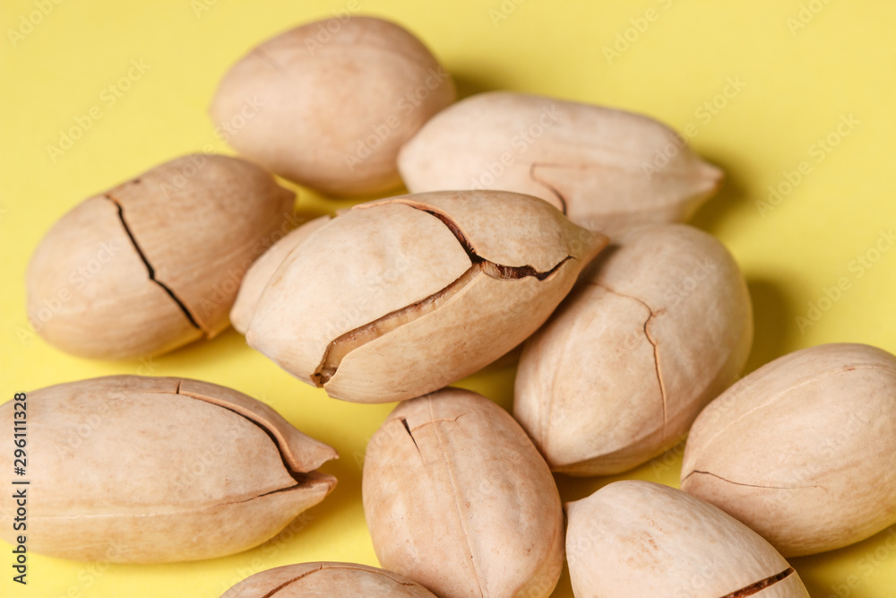 Obraz premium Background: pecan on a yellow background