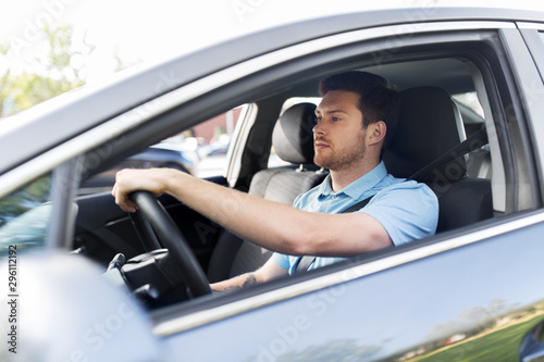 transport, vehicle and people concept - man or driver driving car in summer
