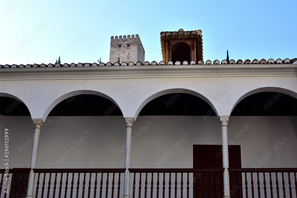 view of an arabic tower on the roof of a gallery with arches