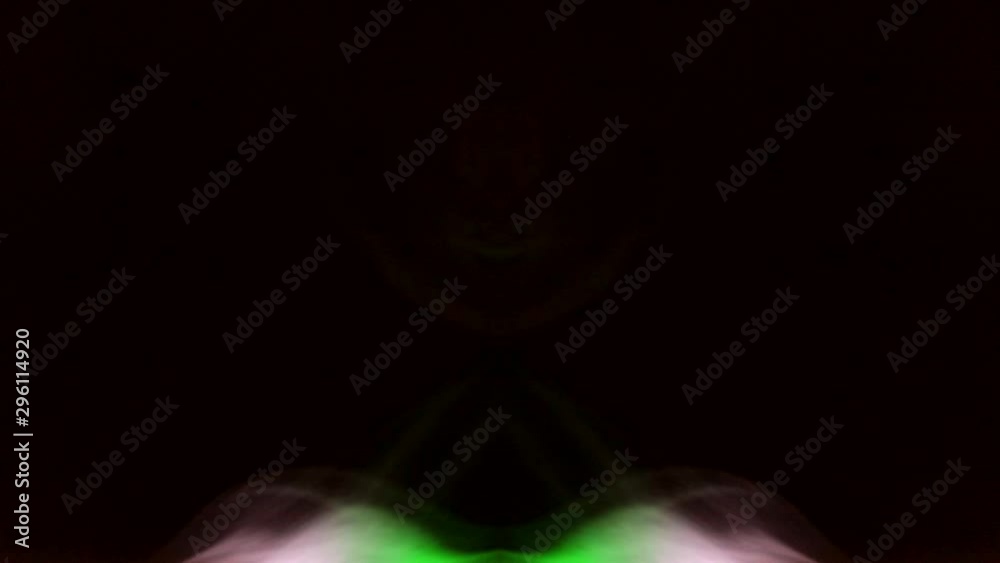 Sexual anatomical fantasies. Colored erotic hallucinations. Curly creeping puffs of smoke on a dark background, illuminated by light with different colors. Sexual anatomical fantasies. Colored erotic hallucinations. Curly creeping puffs of smoke on a dark background, illuminated by light with different colors.