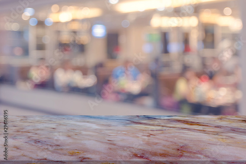 Marble table with restaurant blur background