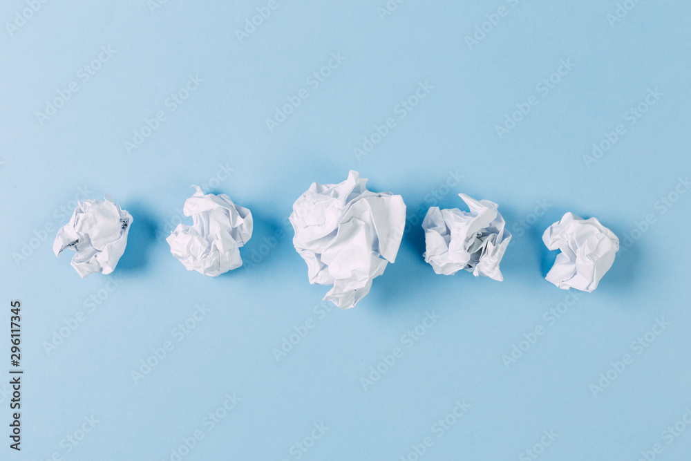 Close-up of Crumble paper isolated on blue background Close-up of Crumble paper isolated on blue background