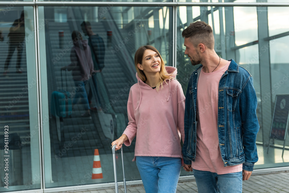 Couple At Airport. Happy Young People Traveling Together