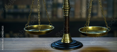 Law and Justice concept. Mallet of the judge, books, scales of justice. Courtroom theme.