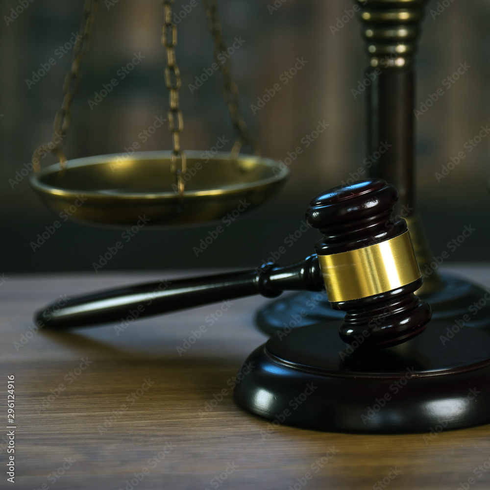 Law and Justice concept. Mallet of the judge, books, scales of justice. Courtroom theme. Law and Justice concept. Mallet of the judge, books, scales of justice. Courtroom theme.