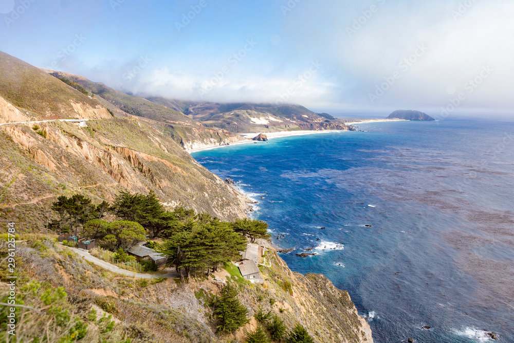 coast in big sur with Point Sur Light at horizon