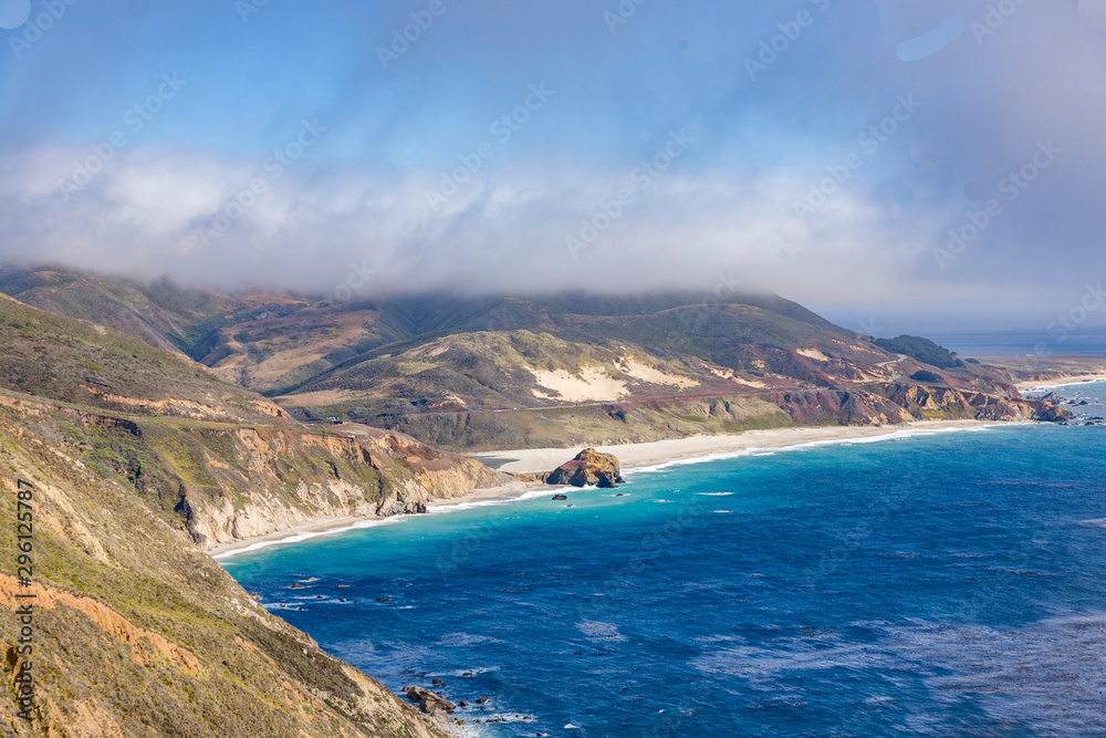 coast in big sur with Point Sur Light at horizon