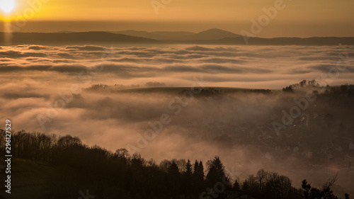 hills valley foggy cloudy landscape © denfran