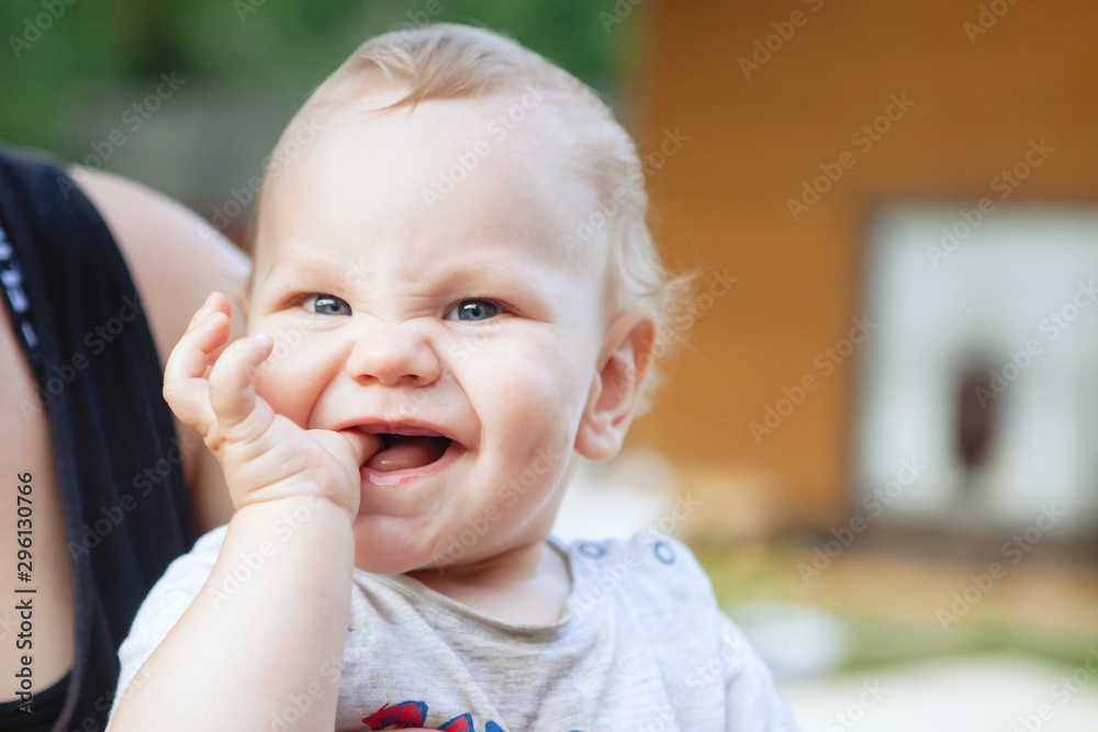 Cute boy with blond hair and blue eyes