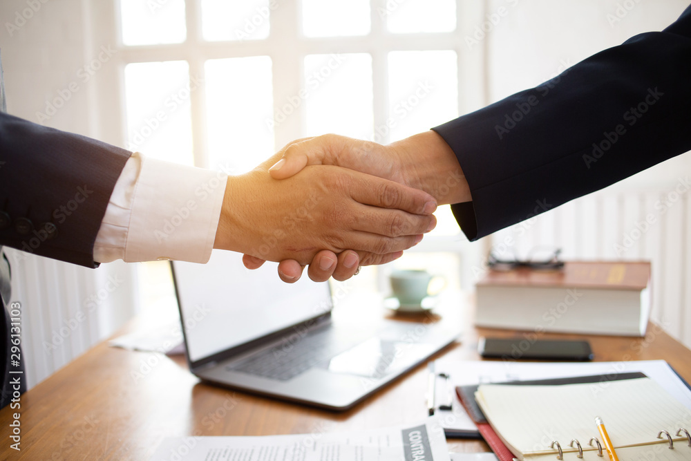 The lawyer shaking hand agreement for consult preparing the phrase to be law for people who come to listen to counseling to receive social justice..concept of business The lawyer shaking hand agreement for consult preparing the phrase to be law for people who come to listen to counseling to receive social justice..concept of business