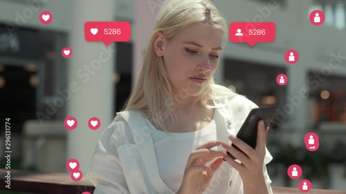 Blonde young woman use phone feel happy at sunlight vlogger influencer animation with user interface - likes, followers, comments for social media from smartphone slow motion photo