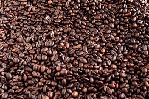 Roasted coffee beans background, arabica and robusta.