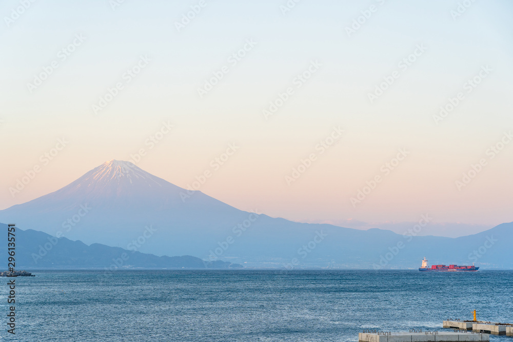 Miho beach Fuji mountain and big boat transport on sea, twilight sunset time at Miho No Matsubara, Shimizu, Shizuoka, Japan.