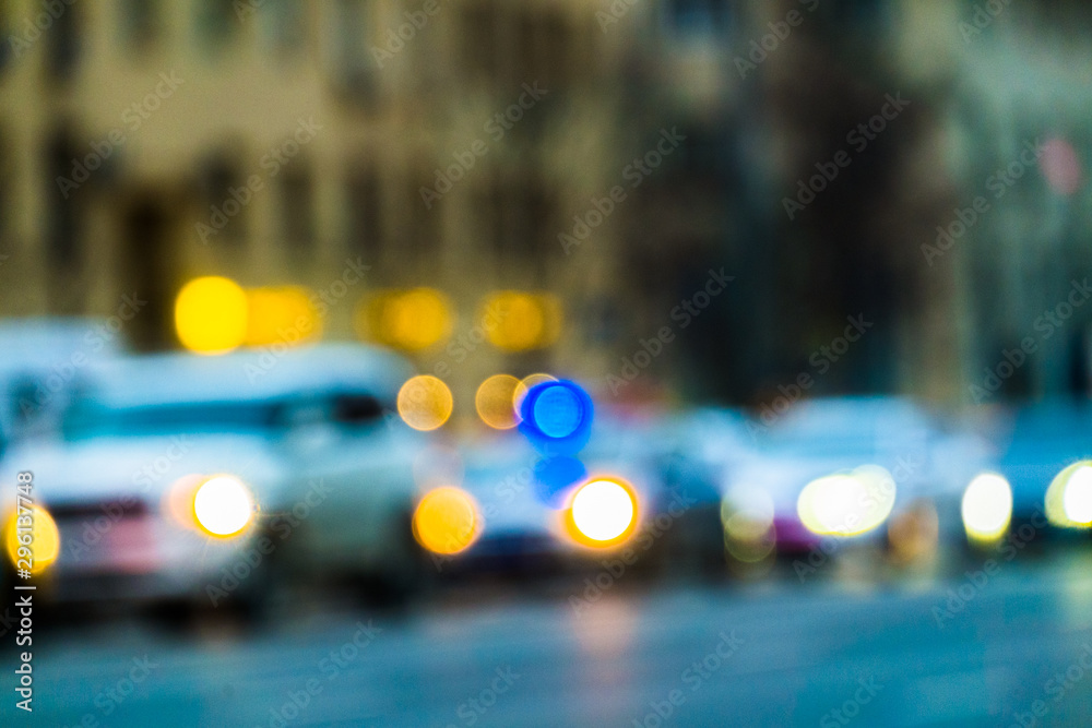Abstract blurred background of evening city.Night traffic,colorful lights Abstract blurred background of evening city.Night traffic,colorful lights